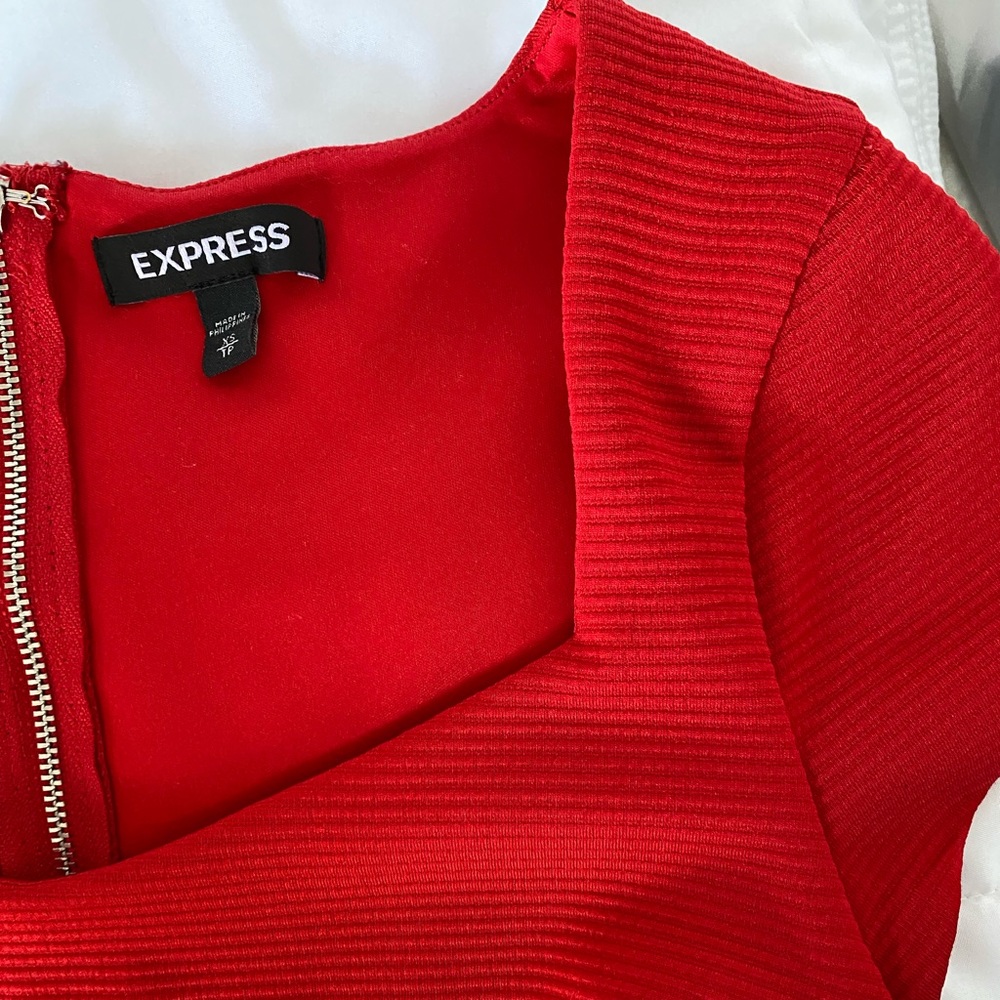 Express red dress in a size XS. Goes down to the knee but has a sexy slit. - Picture 3 of 6